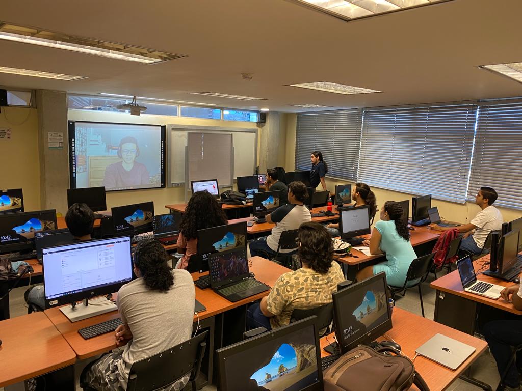 Iván Iguarán giving a remote session to a classroom via video